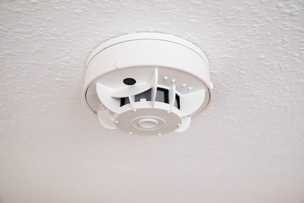 domestic smoke alarm or smoke detector at ceiling
